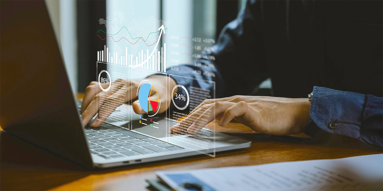 A businessman tracks key types of financial information, leveraging reporting tools for efficiency, accuracy and better-decision making